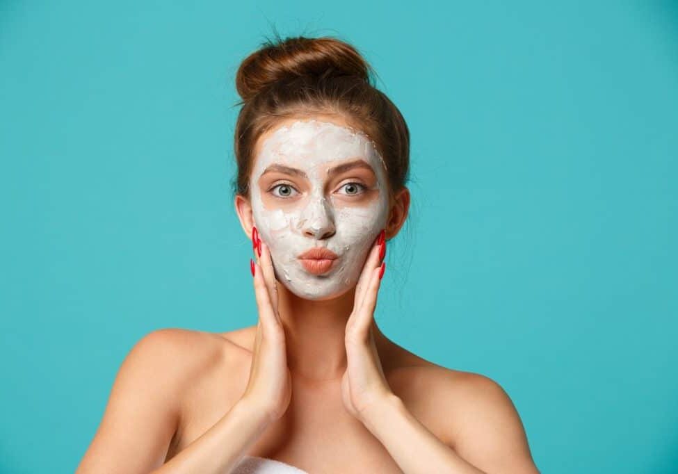beauty-treatment-woman-applying-clay-face-mask